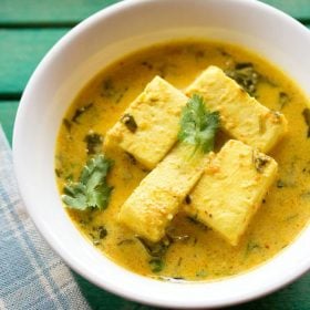 methi paneer garnished with coriander leaves and served in a white bowl.