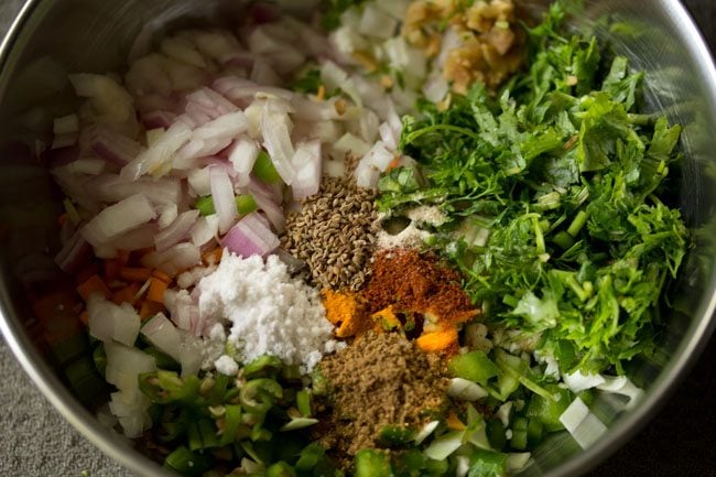 spices and seasonings added to mix vegetables