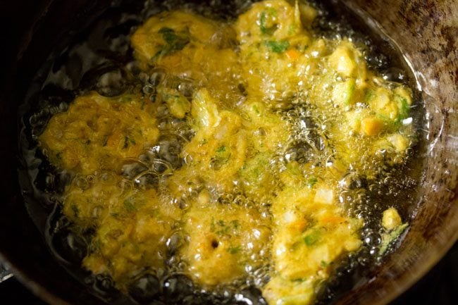frying mix vegetable pakoda in oil