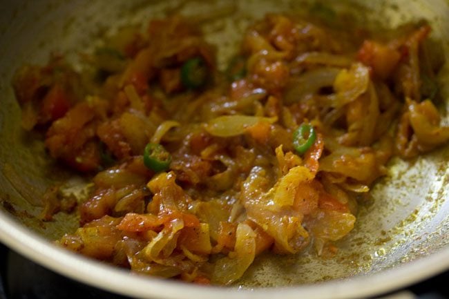 mix the spices with the onion-tomato mixture.