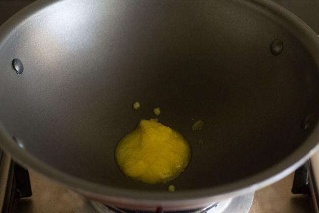 heating ghee in a pan.