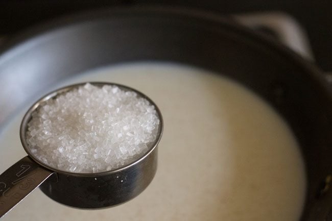 adding sugar to the pan.