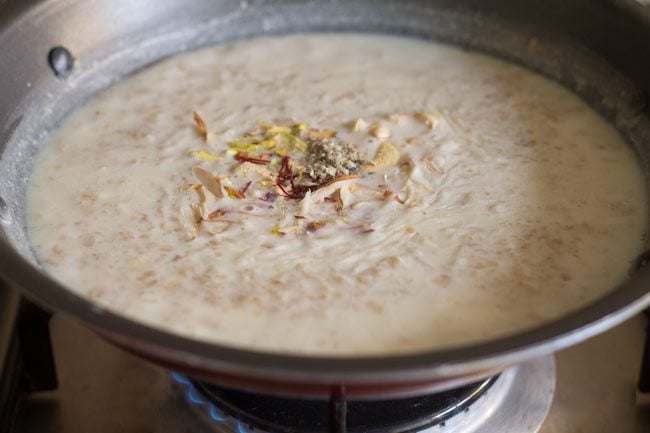 chopped dry fruits, raisins, saffron strands and cardamom powder added to oats kheer mixture. 