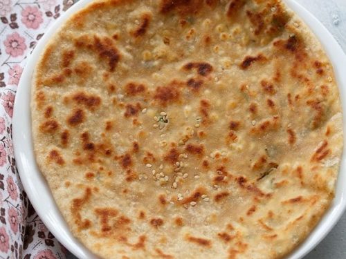 paneer kulcha served on a white plate.