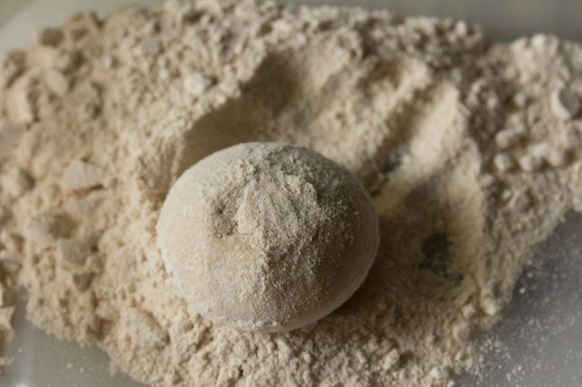 dusting the dough balls with whole wheat flour. 