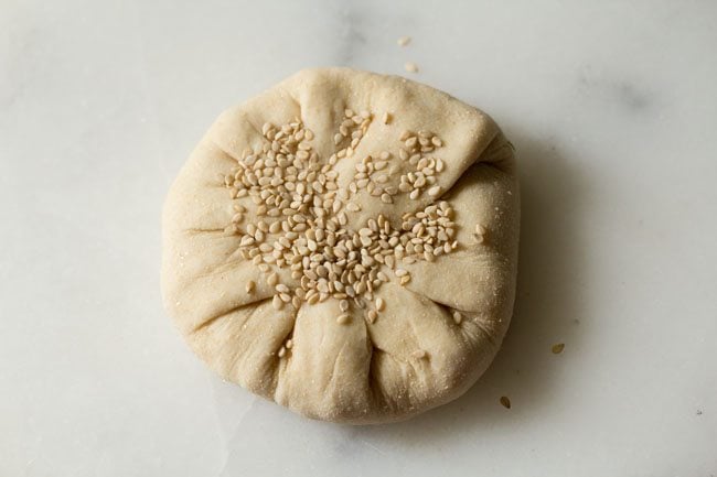 sesame seeds stuck on the prepared dough dumpling. 