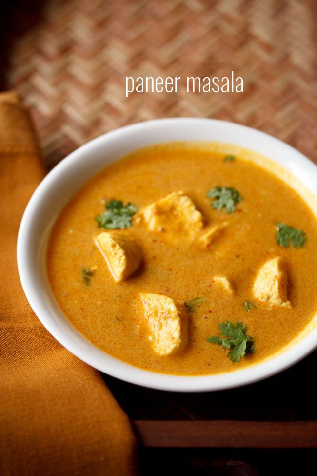 paneer curry garnished with coriander leaves and served in a white bowl.