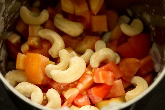 tomatoes and cashews added to blender jar