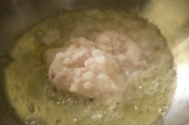 onions added to pan with hot oil