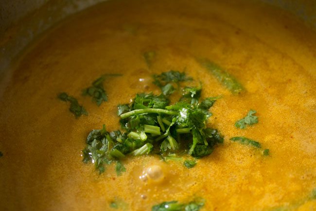 fresh coriander added to paneer curry recipe