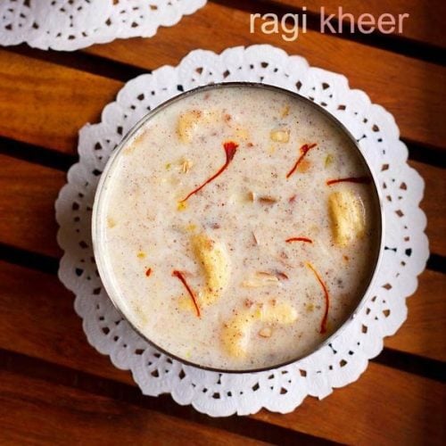 top shot of ragi kheer or ragi pudding served in bowls kept on a wooden table with text layovers.