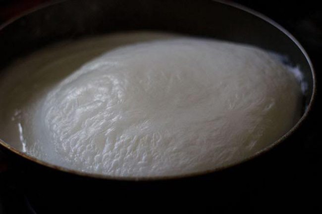 heating milk in a pan. 
