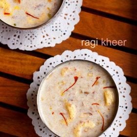 top shot of ragi kheer served in bowls kept on a wooden table with text layovers.