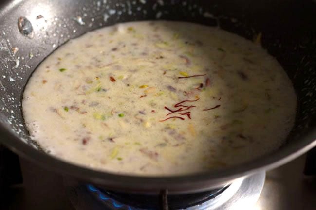 saffron strands added to kheer mixture. 