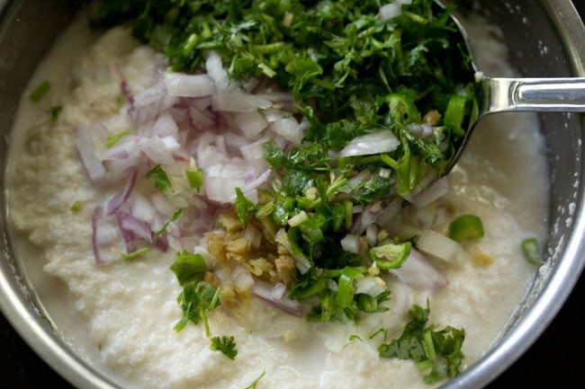 finely chopped onions, chopped green chilies, finely chopped ginger and chopped coriander leaves added to the batter for rava chilla. 