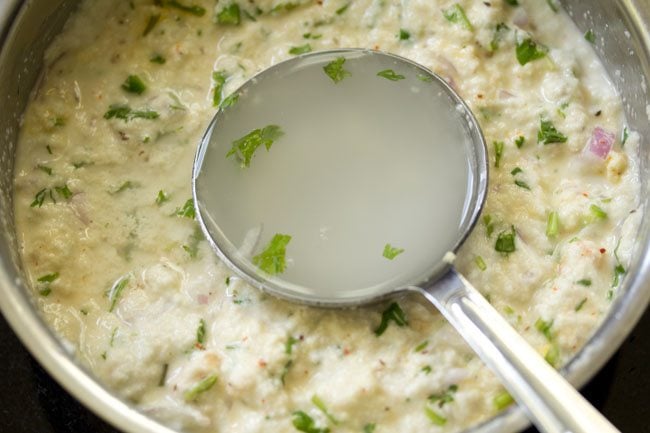 adding water again in the rava chilla batter. 