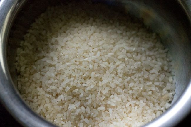 idli rice added to another bowl. 