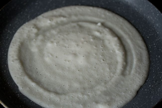 cooking sabudana dosa. 