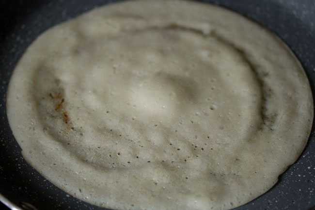 cooking sabudana dosa. 