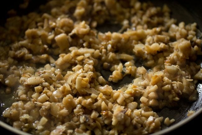 mixing and sauteing as mushrooms release water into pan.