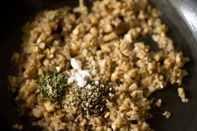 salt added to pan with mushroom filling. 