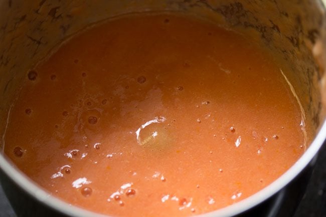 tomatoes blended to a smooth puree without any water for making tomato dhaniya shorba. 