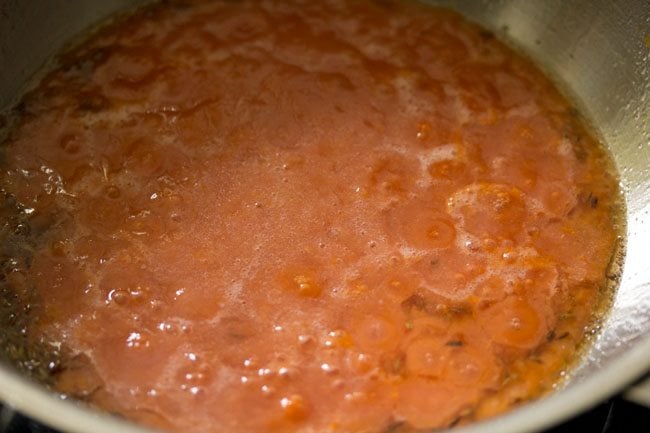 prepared tomato puree added to the pan. 