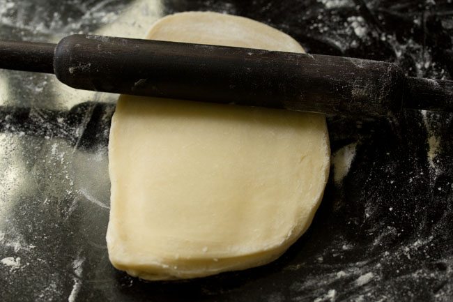 rolling out puff pastry dough.