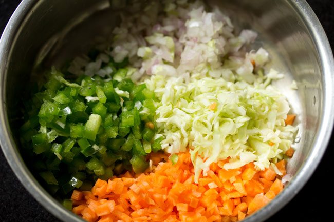 chopped mixed vegetables added to a mixing bowl.