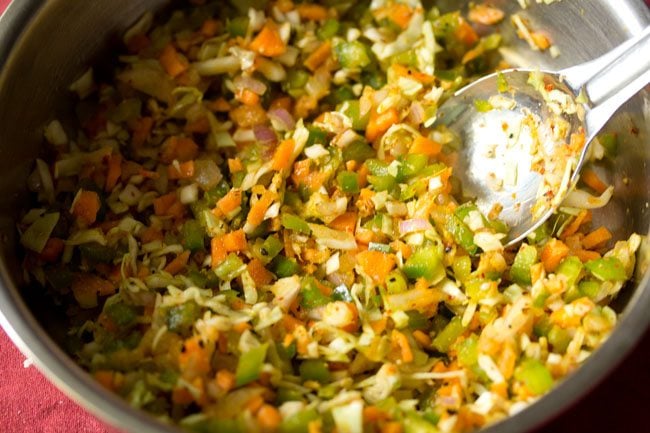 mixing the vegetables with the spice powders and seasonings well. 