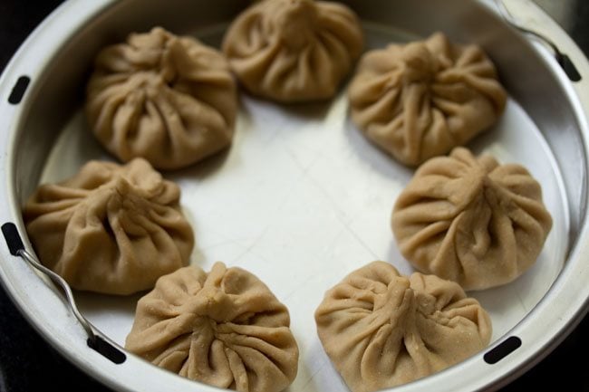 shaped momos ready to be steamed.  