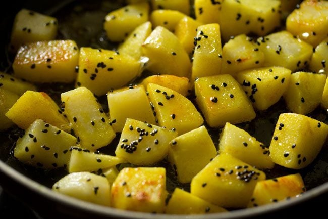 turmeric powder mixed well with the potatoes. 