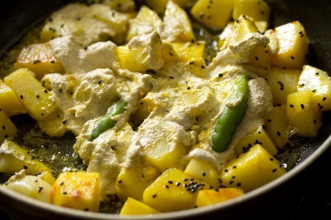 poppy seed paste and whole green chilies added to the potatoes. 