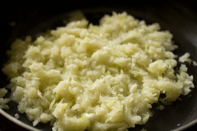 cooking ash gourd for making ash gourd halwa. 