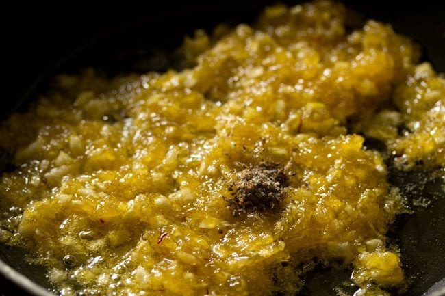 cardamom powder added to cooked kashi halwa. 