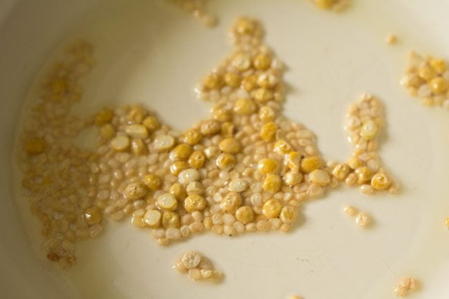 sauteing lentils in a pan