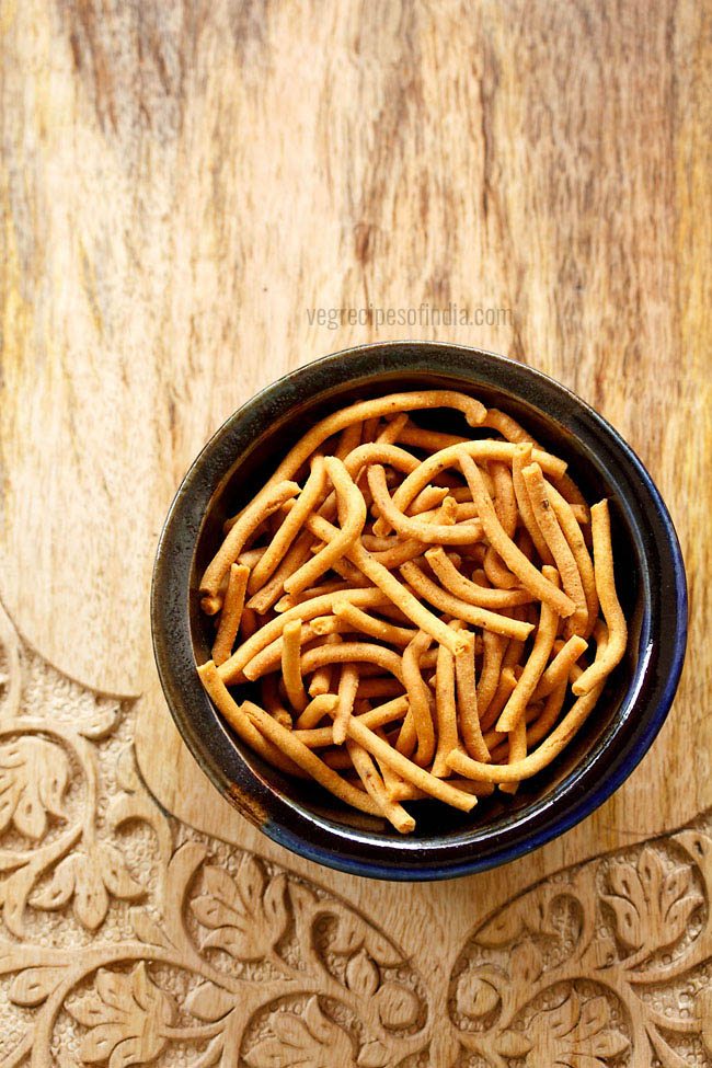 sev served in a black bowl with text layover.