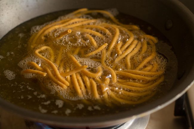 frying besan sev till golden and crisp from all sides. 