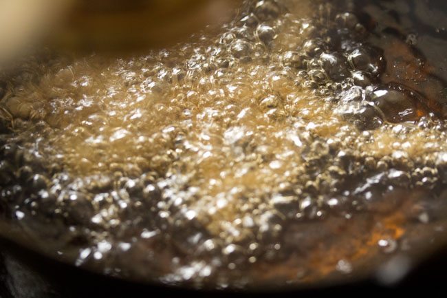 frying butter murukku in hot oil. 