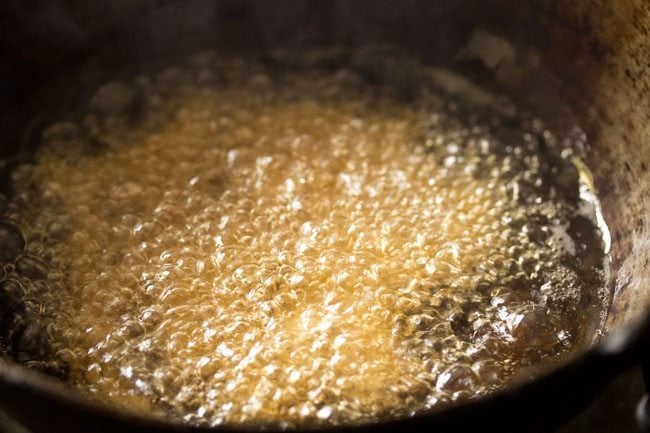 frying butter murukku in hot oil. 