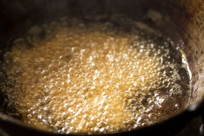 frying butter murukku in hot oil.