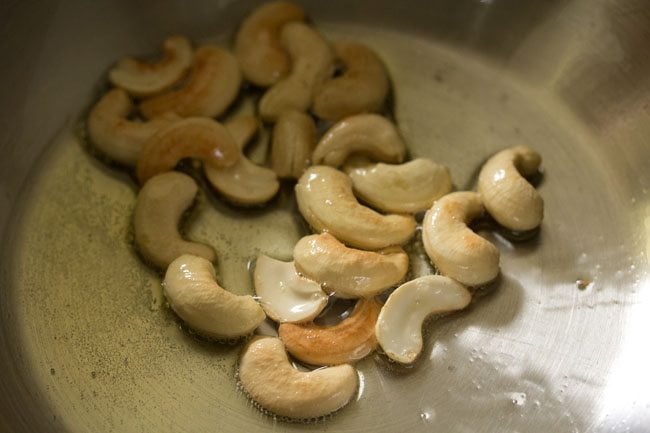 frying cashews till golden for chow chow bath. 