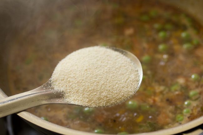 adding roasted rava in boiling water. 