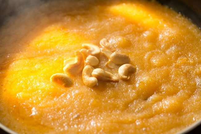 fried cashews added to cooked kesari bath.