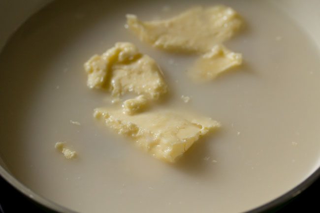 salted butter, sugar, water and condensed milk in a pan on a low flame