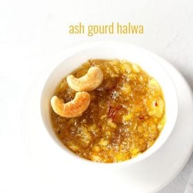 kashi halwa garnished with fried cashews served in a white bowl on a white plate with text layovers.