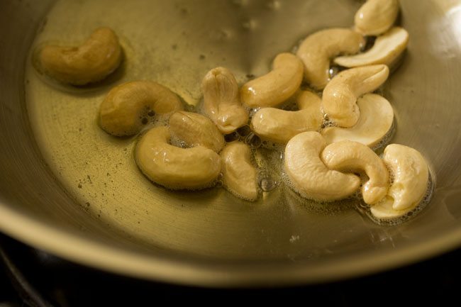 cashews added to hot ghee. 