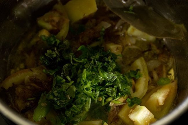 sliced green chilies, chopped mint leaves and chopped coriander leaves added to the pan. 