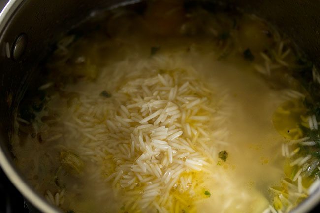 rice added to the boiling water mixture. 