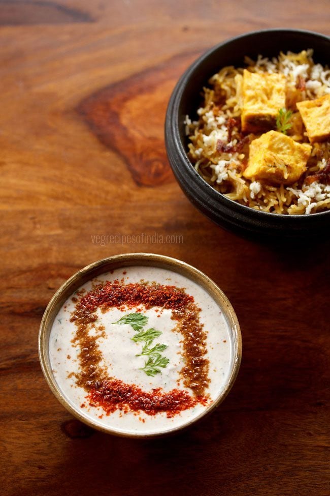 masala raita served with paneer biryani in a bowl